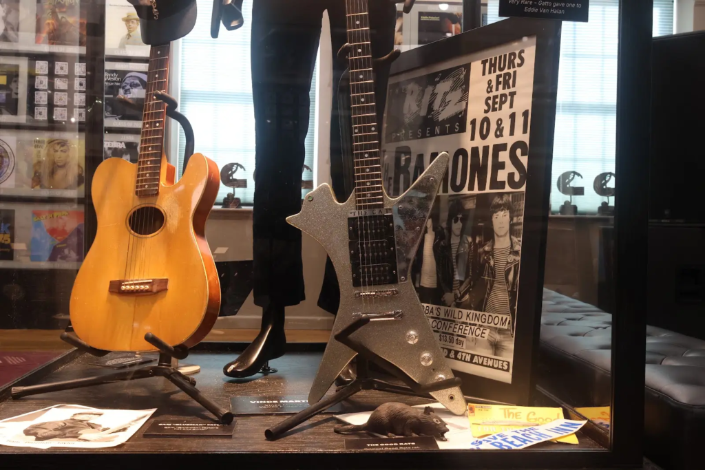 A display of items belonging to or depicting music artists like the Ramones, the Good Rats, and Sam “Bluzman” Taylor. Chris Cabrera/Greene Team, July 29